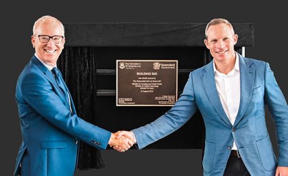 Minister for Sport Mick de Brenni and UQ Pro-Vice-Chancellor Professor Tim Dunne shake hands in front of the building plaque